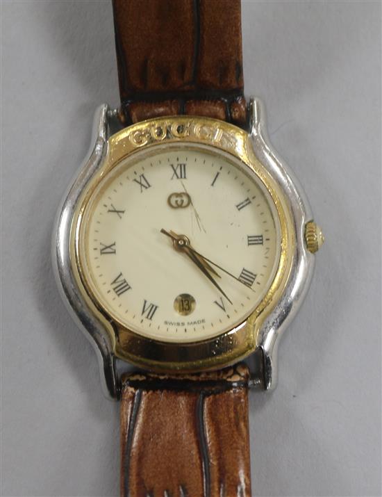 A ladys stainless steel and gold plated Gucci quartz wrist watch.